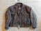 Brown leather jacket by Wilsons is men's size XL and in good condition.