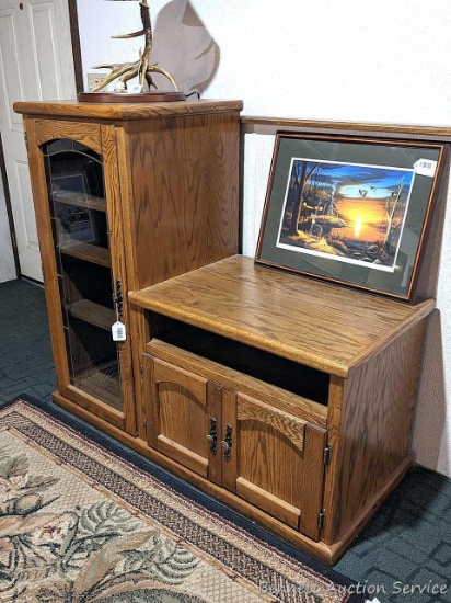 Nice wooden cabinet in good condition has a leaded glass door. Measures about 52" x 22" over base