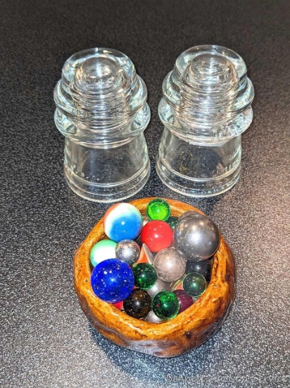 Two Hemingray glass insulators; cute little pottery dish holds a nice collection of marbles.