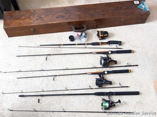 Four 2-piece fishing rods. Two Abu Garcia Hellbender rods with Cardinal 963 and 964 reels; other