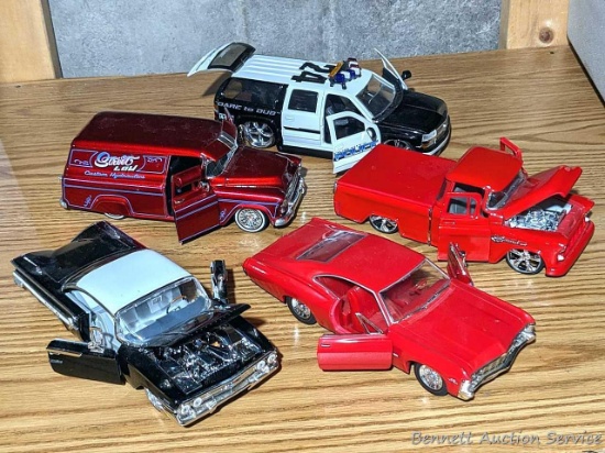 Five 1/24 scale model cars with doors and hoods that open. Many marked Jada Toys on the bottoms.