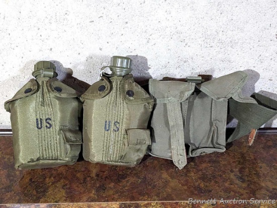US Military canteens with insulators, plus a 7" wide pouch all mounted on a 2" x 66" belt. Bottoms