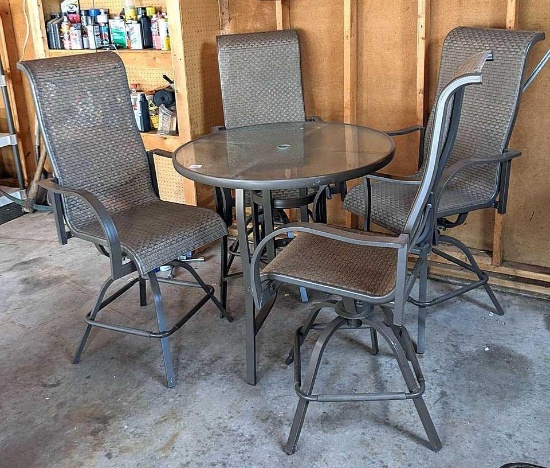 3' diameter glass topped patio table comes with four swiveling stools. All in good condition.