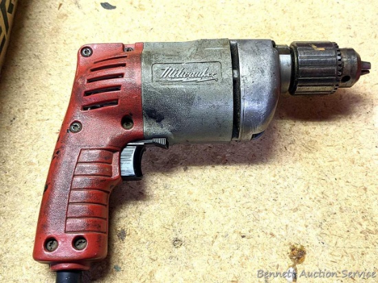 Milwaukee 3/8" corded drill. Runs well, forward and reverse.