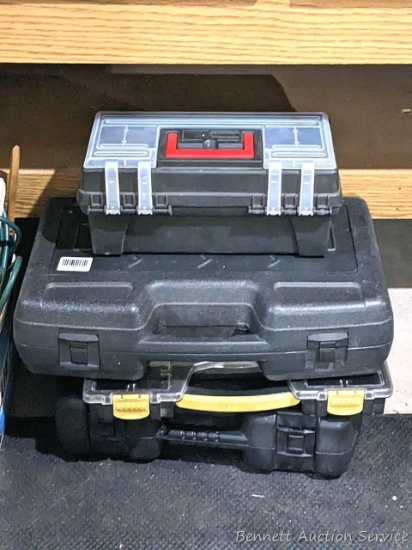 Four hard plastic tool cases up to 20" wide.