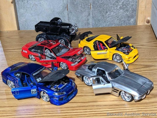 Super cool model cars up to 9" long, see pics for markings on bottoms. Doors open, and most hoods.