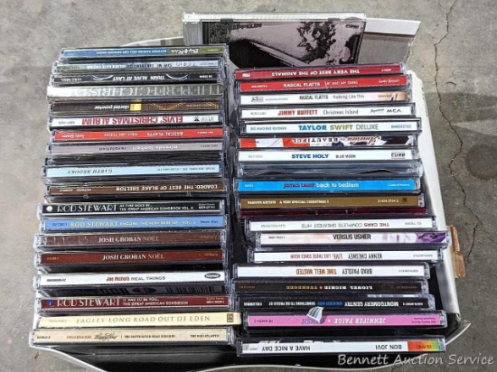 CDs incl Taylor Swift, The Animals, more. One TS missing, Elvis cd not in case, other cases