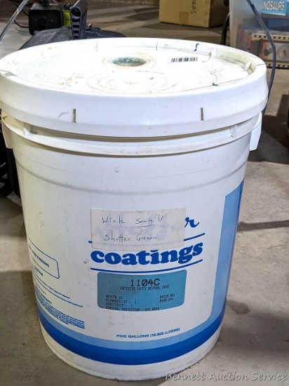 5 gal bucket of green paint feels around half full.