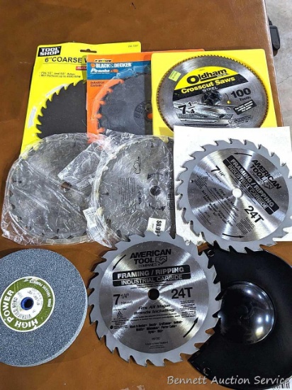 3" tall stack of 7" saw blades, some new looking or lightly used.