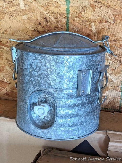 11" tall drink cooler with a galvanized look to it.
