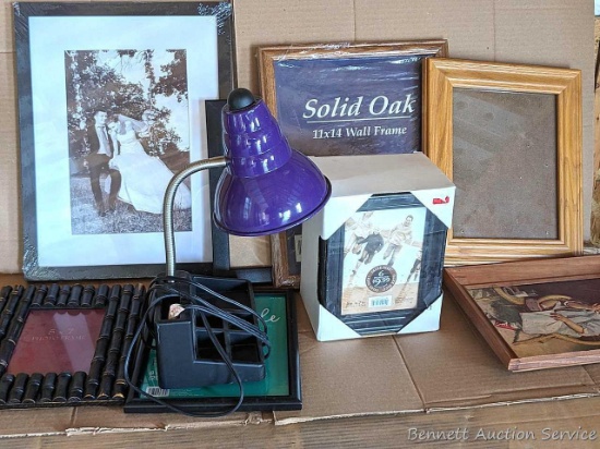 Large stack of different size frames up to 17"x13", photo books, desk light, more.
