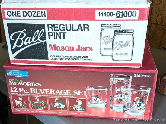 One dozen canning jars some with lids, and several festive drinking glasses.