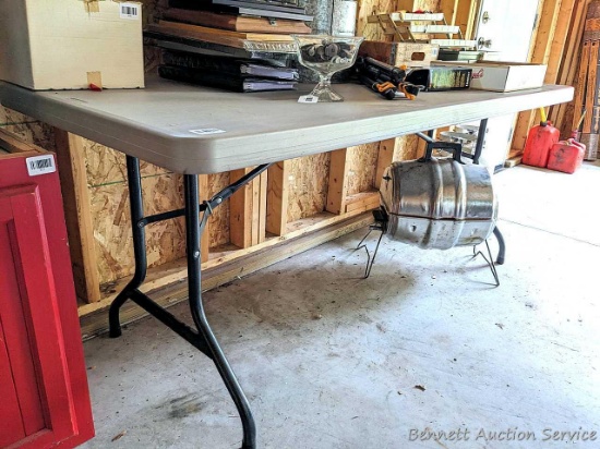 Lifetime folding 6' table. The table is in very good condition with a few scuffs on the edges.