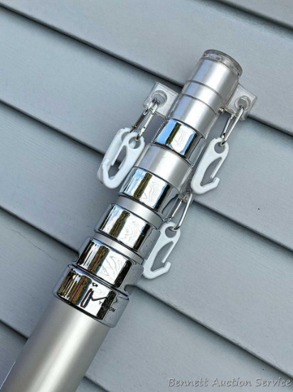 Extendable aluminum flag pole or similar, it has 6 extendable pieces and stands approx 76" tall when
