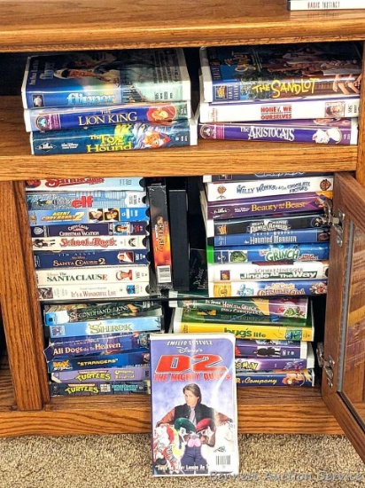 Children's VHS tapes including Shrek, D2, Willy Wonka, The Sandlot, School of Rock, The Lion King,