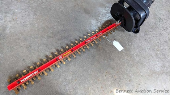 Remington electric 24" Titanium hedge trimmer is in good condition.