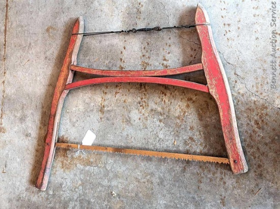 2-1/2' buck saw has classic red paint and is in good shape.