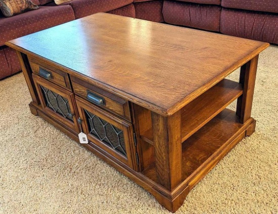 Beautiful coffee table has through-storage and measures 28" x 48" x 20" high. Matches Lot 45, 51, 53