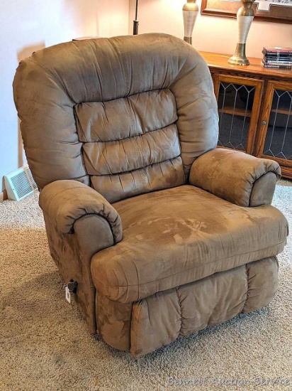 Rocker recliner is clean and in good condition. Comfortable chair rocks and reclines as it should.