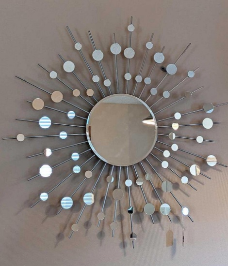 Classic sunburst pattern wall mirror is approx. 38" diameter. A great accent piece.