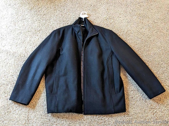 Men's Calvin Klein coat is size XL. Wool blend coat is in very good condition.