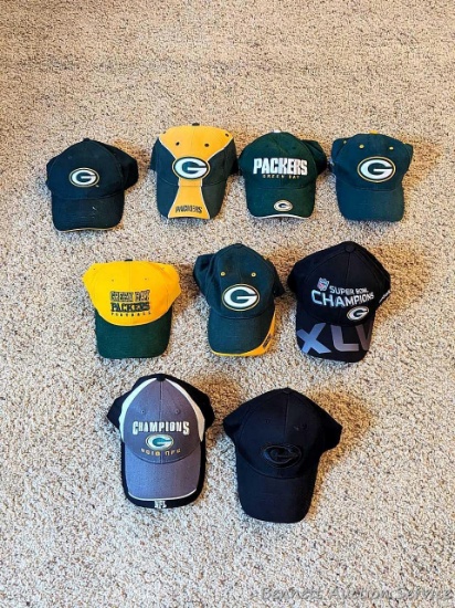 Green Bay Packer hats - all different styles, most near-new.