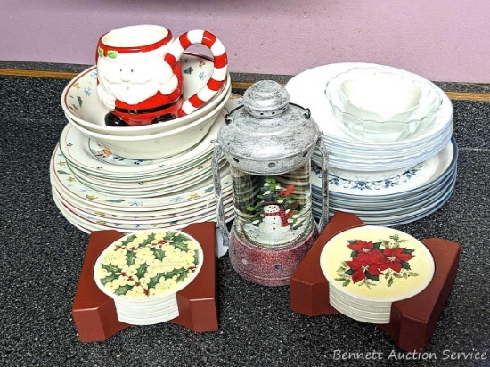 Christmas dishes including plates, a couple of bowls, Santa mug, lantern shaped snow globe,