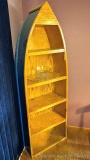 Boat or canoe style shelf stands 6' tall and is 25