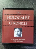 Coffee table book entitled 'The Holocaust Chronicle' is in good condition.