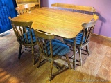 Drop leaf kitchen table comes with four chairs and a bench. Nice smaller set measures 50