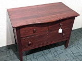 Antique cabinet with dovetailed drawers and casters is in nice condition and measures about 34