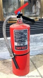 Large Sentry fire extinguisher is charged and ready to go. About 21