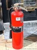 Large industrial fire extinguisher is charged and ready to go. About 19