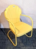 Neat yellow lawn chair is in good condition and about 20