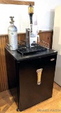Haier kegerator has a Lakefront Brewery tap handle, comes with pitchers, accessories as pictured.