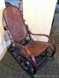 Caned rocking chair is a classic retro style and in very good condition.