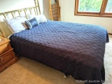 Clean queen sized bed with brass toned headboard. Brand not found on mattress, but it all looks in