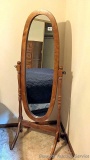 Full length mirror swivels and stands 5' tall.