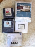 Twin XL bedding including sheet sets and mattress protector; two California king sheet sets.