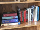 Books including Seal Team Six, Bo Ryan, Study Bible, Student Dictionary, Marley & Me, Debating