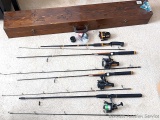 Four 2-piece fishing rods. Two Abu Garcia Hellbender rods with Cardinal 963 and 964 reels; other