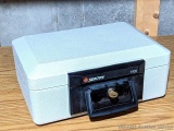 Sentry 1100 fire protection lock box with key and manual. In good condition, about 14