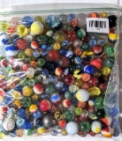 Gallon bag of marbles, larger and smaller.
