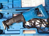 Makita reciprocating saw comes with blades and case.
