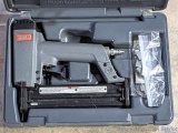 Senco pneumatic nailer with case and manual.