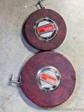 Two Lufkin Yellow tape measures, larger tape is a 100'.