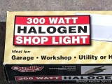 300 watt halogen shop light is new in box - great for garage or workshop.
