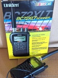 Uniden Nascar scanner is model no. BC72XLT, comes with charging cord and instructions.