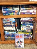 Children's VHS tapes including Shrek, D2, Willy Wonka, The Sandlot, School of Rock, The Lion King,