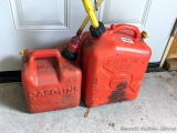 Two gas totes, larger is a 2.5 gallon, and both have spouts.